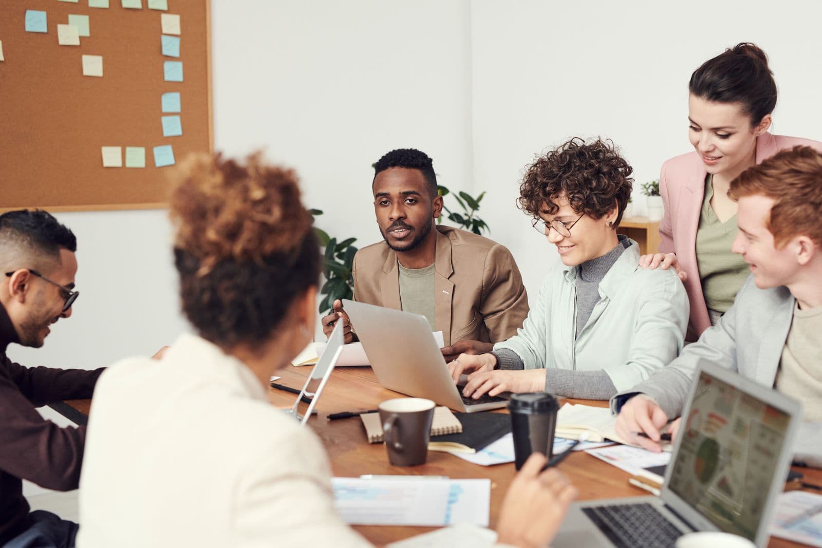 Agency and consulting team collaborating in a professional workspace